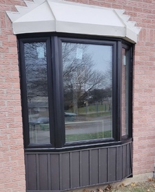 New black bay window with original roof and skirt